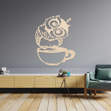 A cheerful wooden owl with coffee as a unique interior accessory