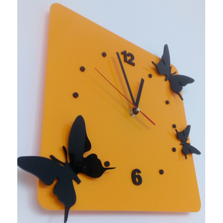 Modern wall clock made of plexiglass. Trendy clock on the wall as a gift. X-momo clocks. PMMA