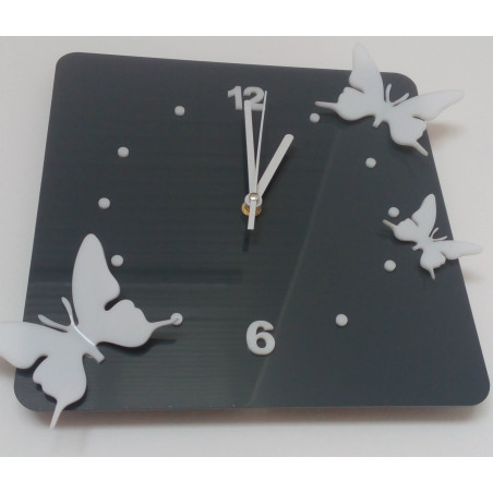 Modern wall clock made of plexiglass. Trendy clock on the wall as a gift. X-momo clocks. PMMA Modern wall clock made of plexiglass. Trendy clock on the wall as a gift. X-momo clocks. PMMA