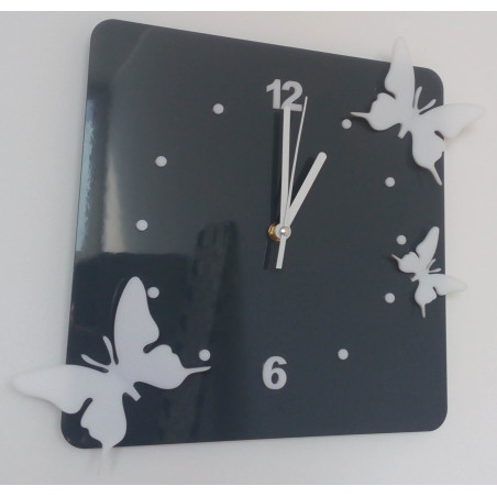 Modern wall clock made of plexiglass. Trendy clock on the wall as a gift. X-momo clocks. PMMA Modern wall clock made of plexiglass. Trendy clock on the wall as a gift. X-momo clocks. PMMA
