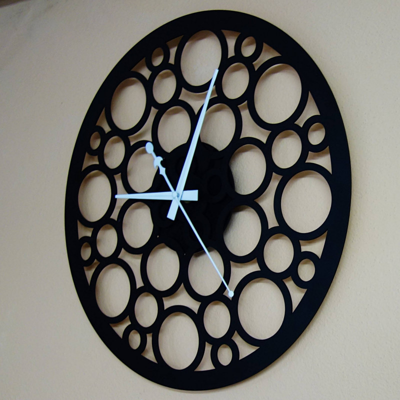 Wall clock made of wood plywood in the footsteps of time