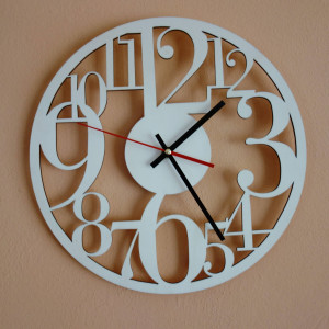 Clock on the wall made of wooden plywood is time to change Filp